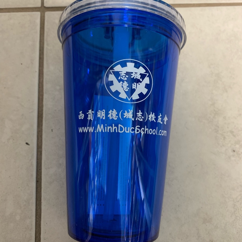 Water cup with straw .